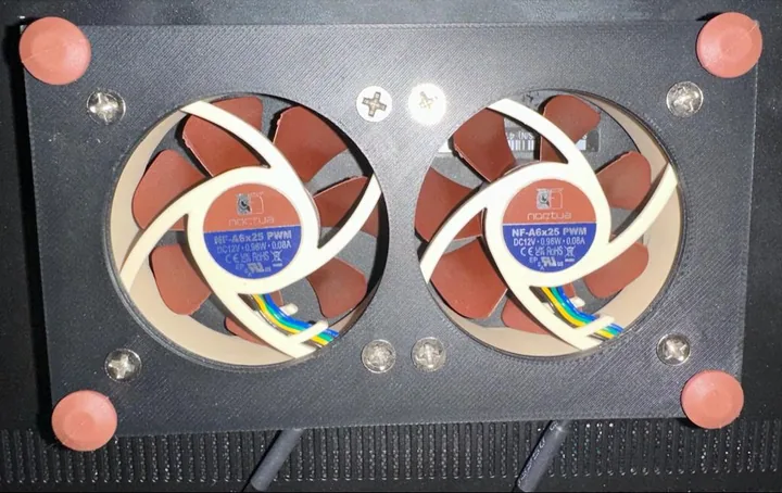 The plate with the fans’ rubber mounts