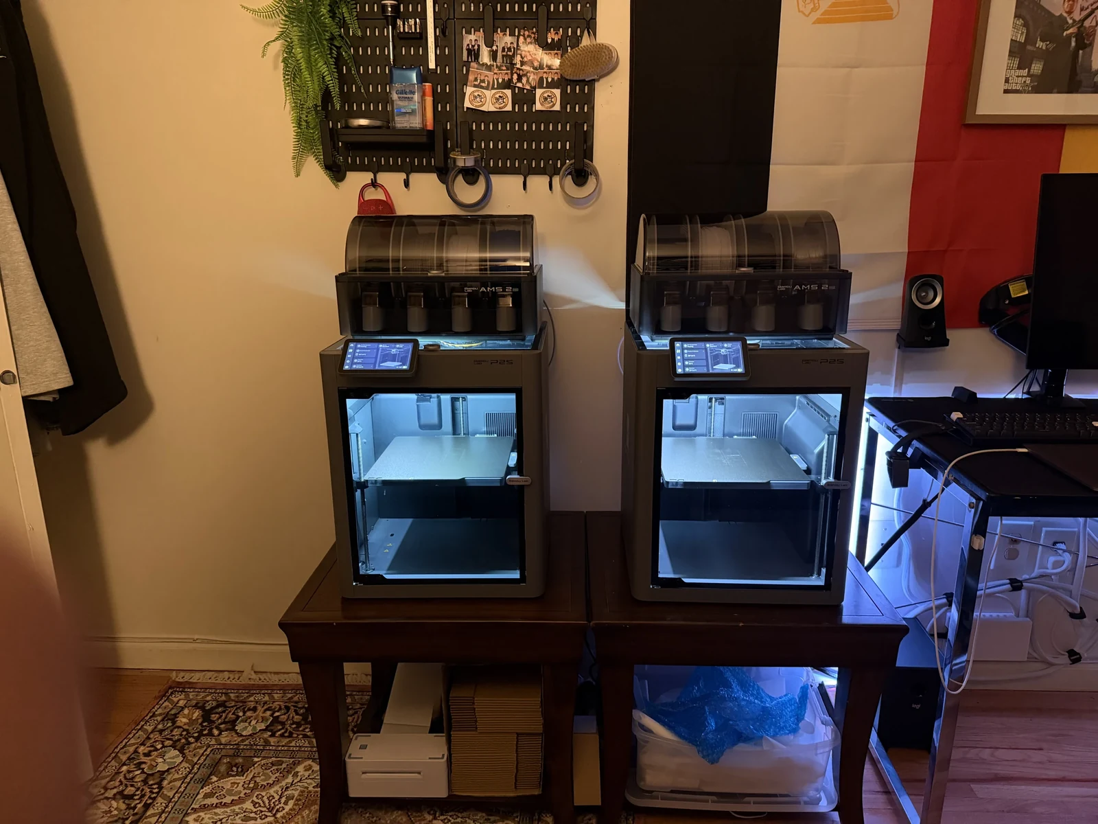 Two enclosed 3D printers side by side in the Bankasi workspace